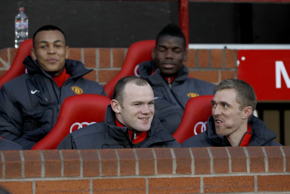 Paul Pogba looks on from the bench - an all too familiar sight for him at United