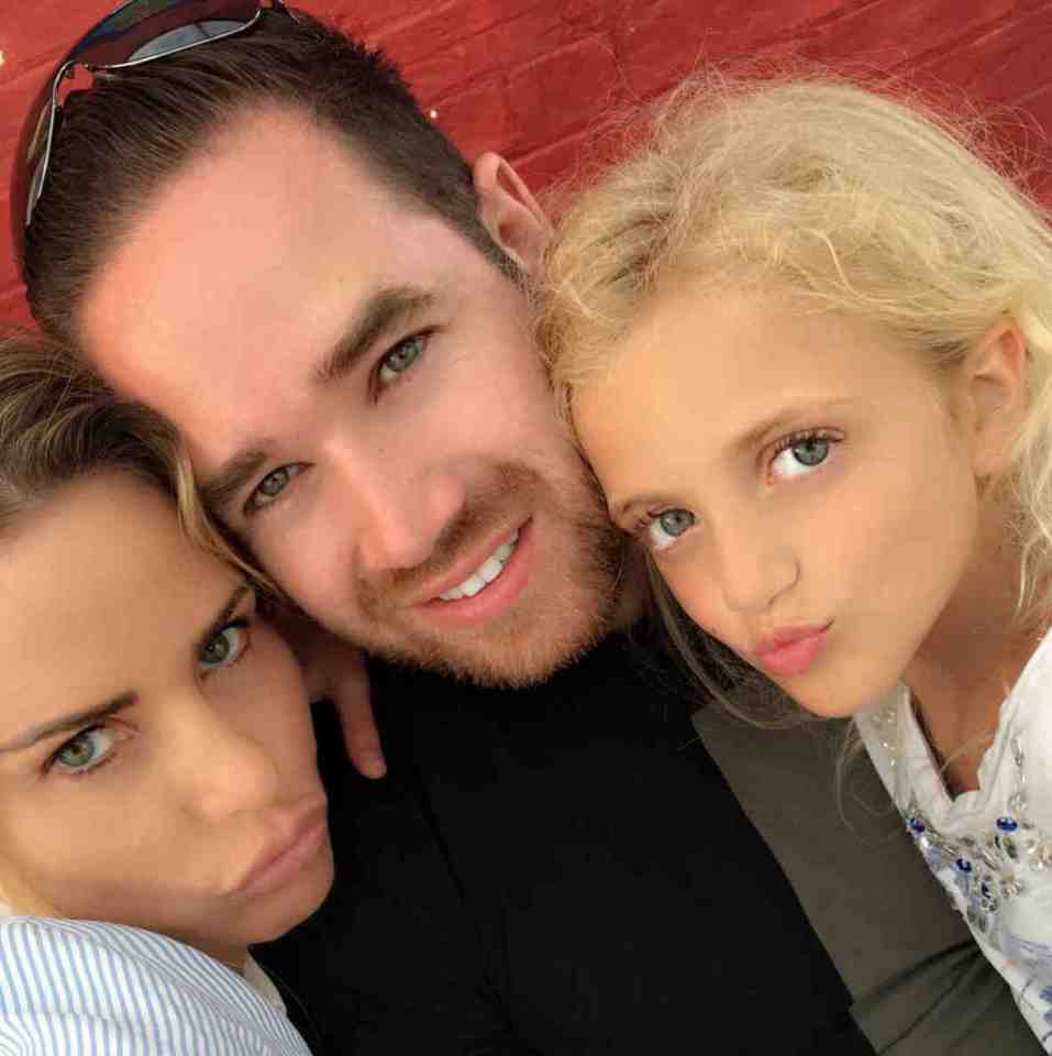  Katie posted a cute selfie with her husband and daughter