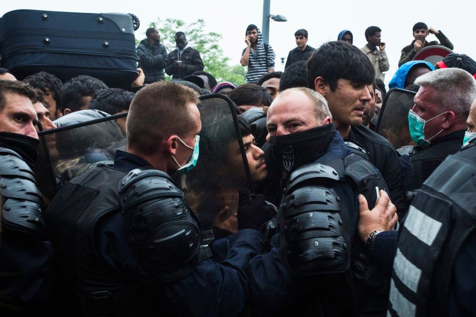 Anti riot policemen wear facemasks as th