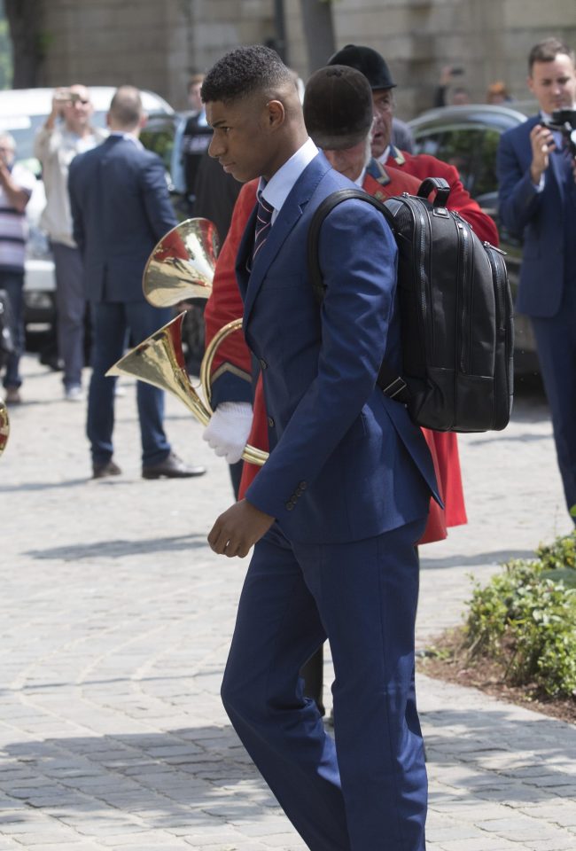  Rashford looks unimpressed in his badgeless custom-made suit