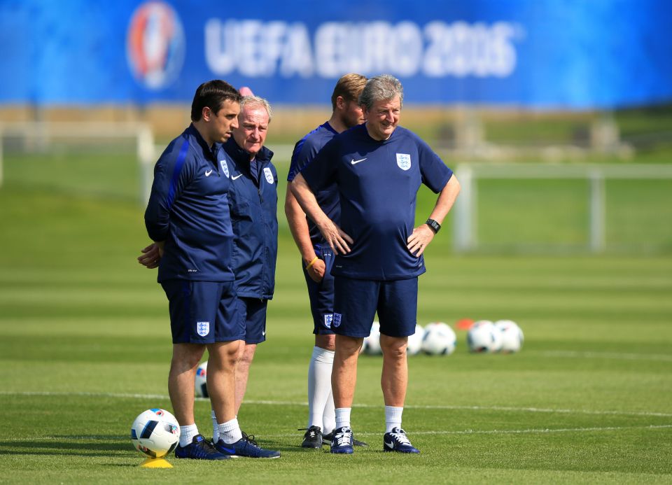  England boss Roy Hodgson watches the action with Gary Neville and Lewington