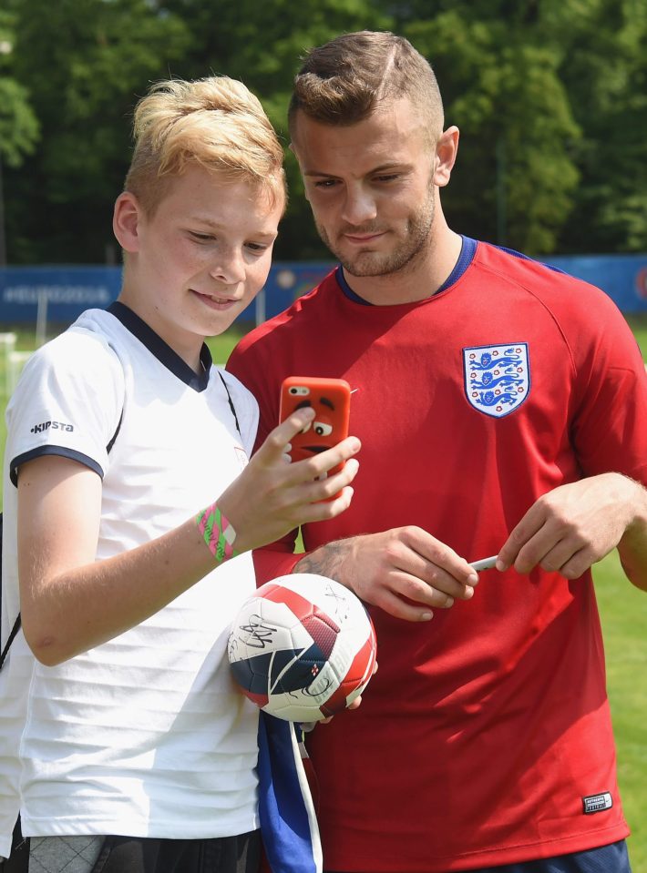 Jack Wilshire poses for a selfie with a fan after the open training session