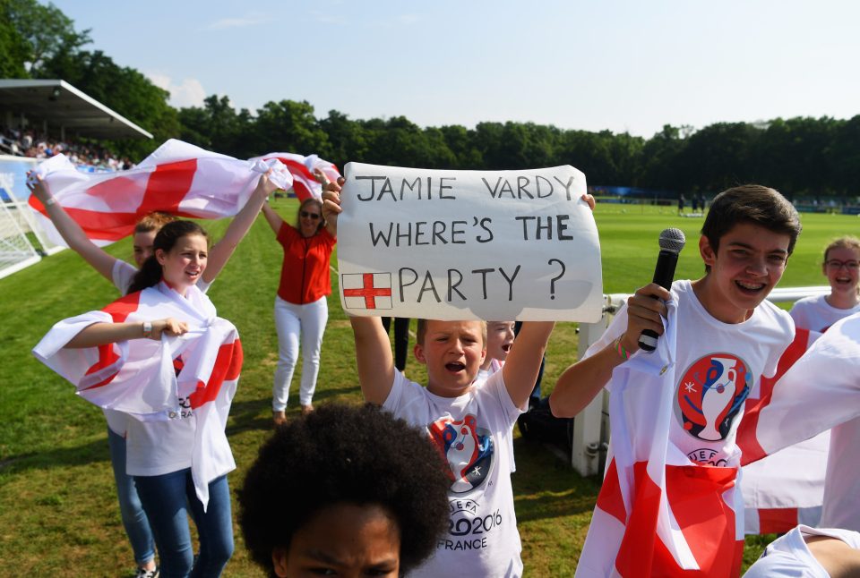 A young fan holds a banner reading 'Jamie Vardy, where's the party?' during Englands open training session