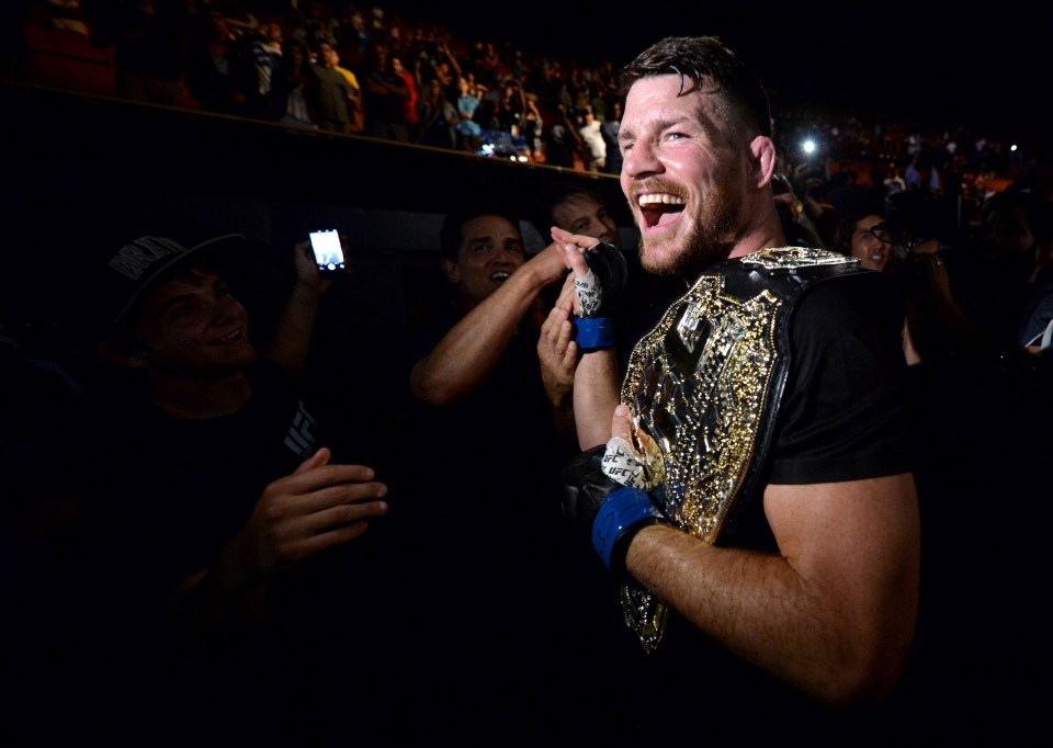  Winners are grinners: Michael Bisping celebrates with the fans at UFC 199