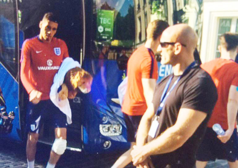  Chris Smalling has strapping on his left knee when returning from training