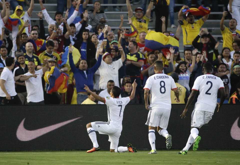  Carlos Bacca celebrates in front of Colombia fans after opening the scoring