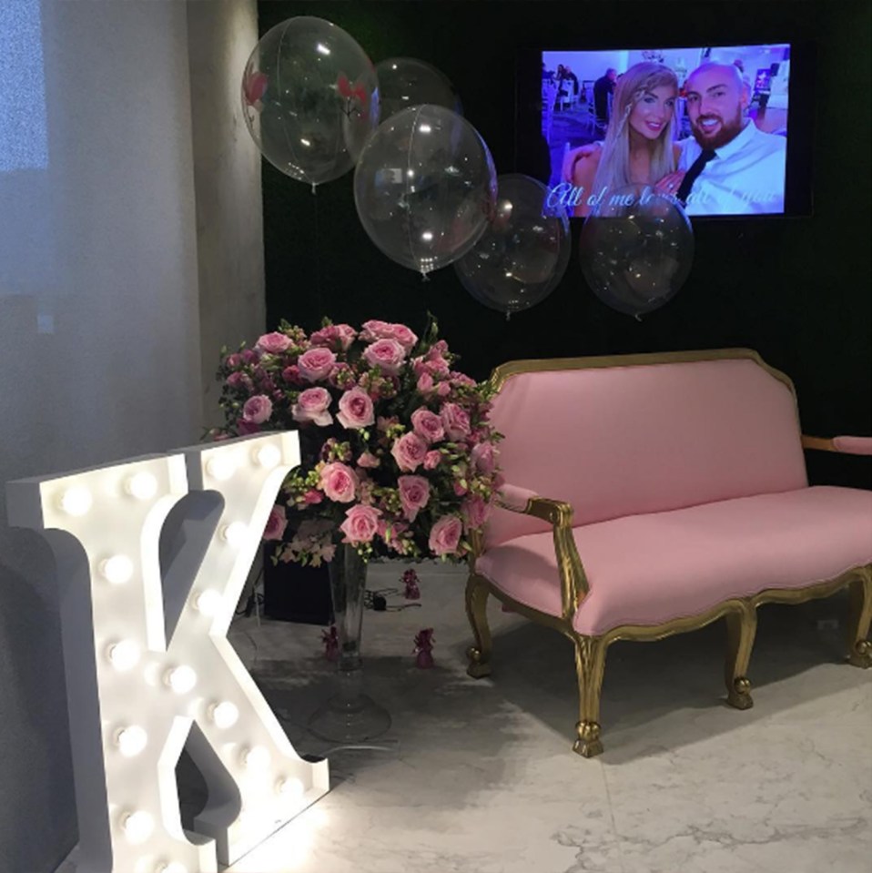  The grand room was decorated with pink roses, balloons and velvet chairs