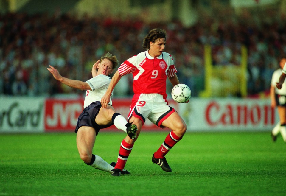 Denmark's Flemming Povlsen fends off the challenge of Stuart Pearce during the goalless draw in Swden