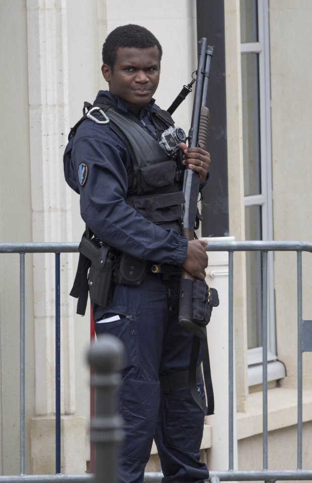  An armed French security officer stands vigilantly as the country braces itself for attacks on the international soccer tournament