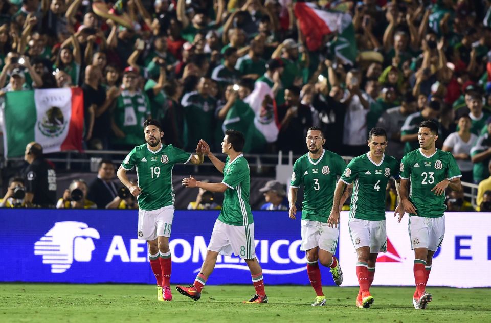 Mexico's Oribe Peralta (L) celebrates with teammates after scoring the team's second goal against Jamaica during the Copa America Centenario football match in Pasadena, California, United States, on June 9, 2016. / AFP PHOTO / Frederic J. BrownFREDERIC J. BROWN/AFP/Getty Images