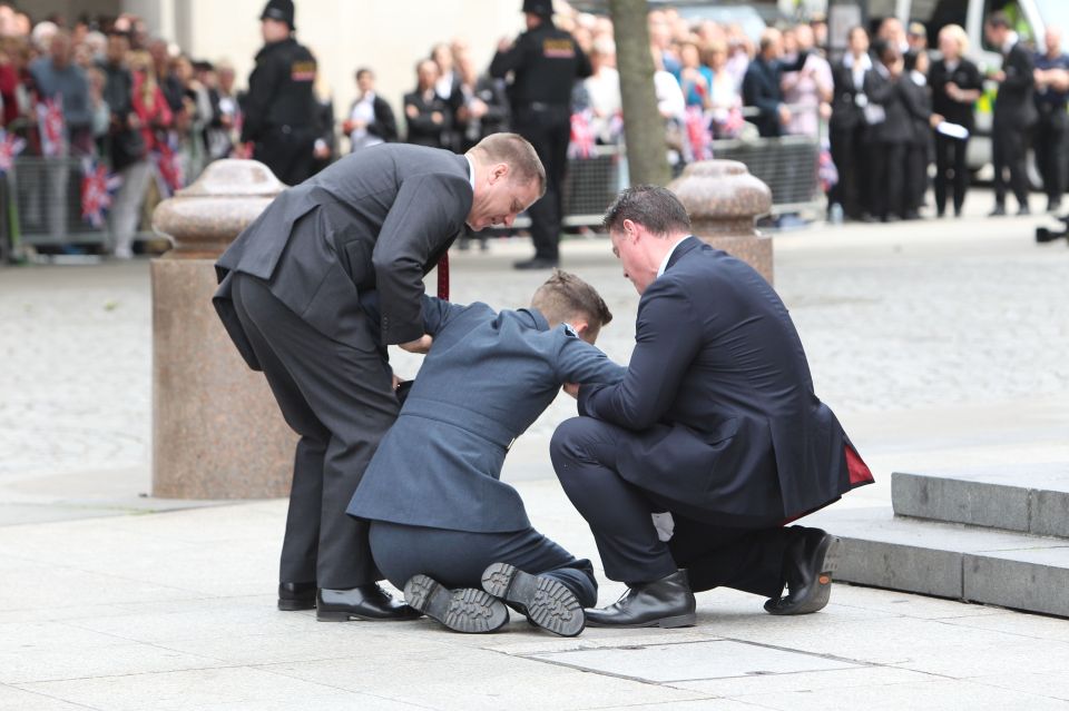  A member of armed forces had to be helped after collapsing before the start of a national service of thanksgiving to celebrate the 90th birthday of Queen Elizabeth II