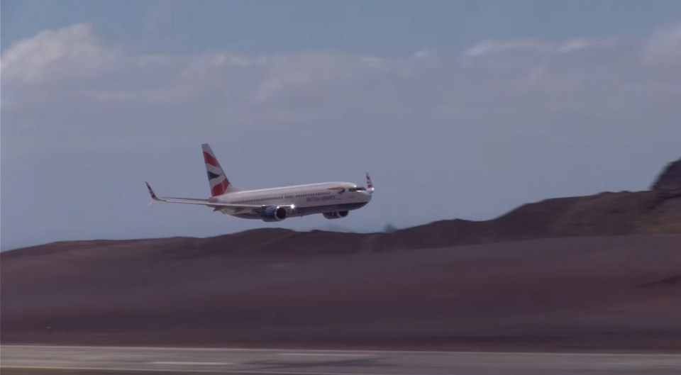 But the plane struggles to touch down on the tarmac as it is hit by heavy winds