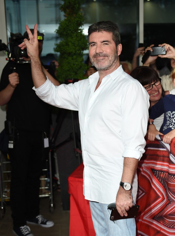  Even Simon managed to crack a smile as he attended the first round of auditions