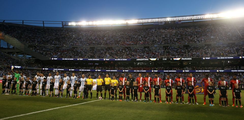  The players line up pre-match at a packed out Soldier Field