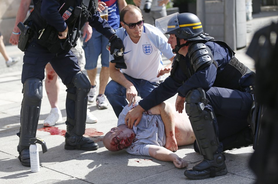  Bloodshed ... French cops tend Mr Bache in Marseilles