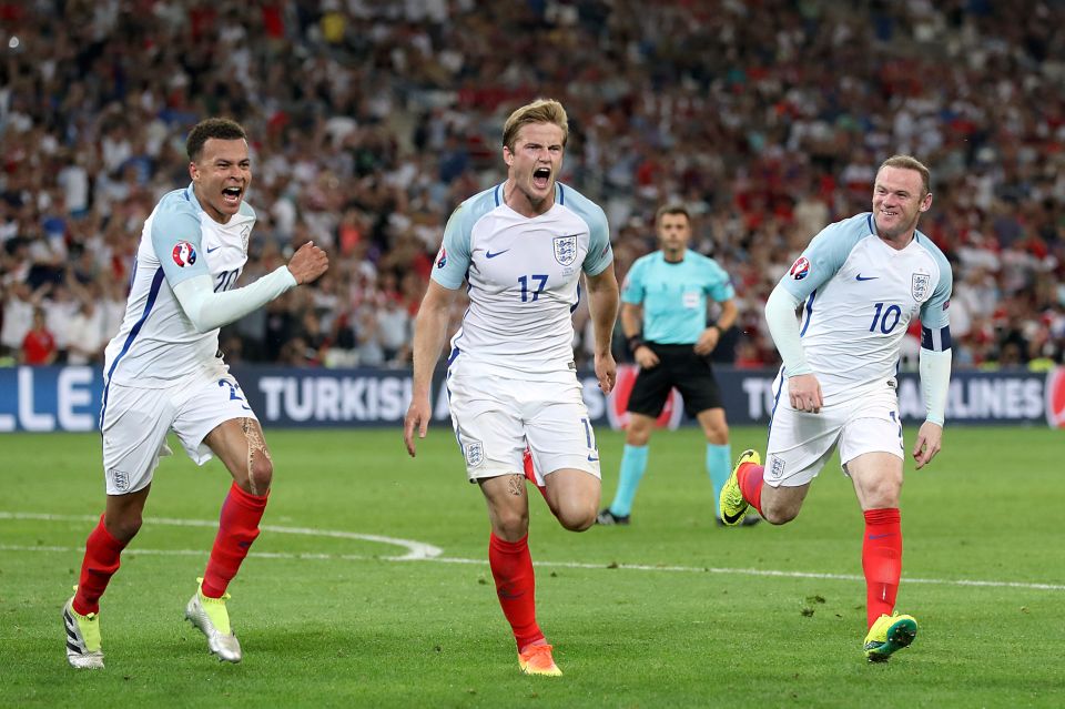  Dele Alli and Wayne Rooney join goalscorer Eric Dier celebrating his free-kick