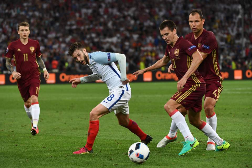  Adam Lallana dances around the Russian defenders in England‘s Euro 2016 opener