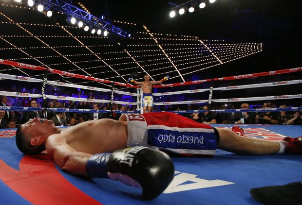 Roman Martinez lies on the canvas after Vasyl Lomachenko's devastating uppercut