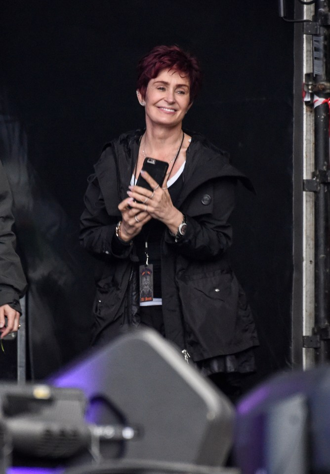  Sharon was pictured supporting her husband at the rain-soaked festival this weekend