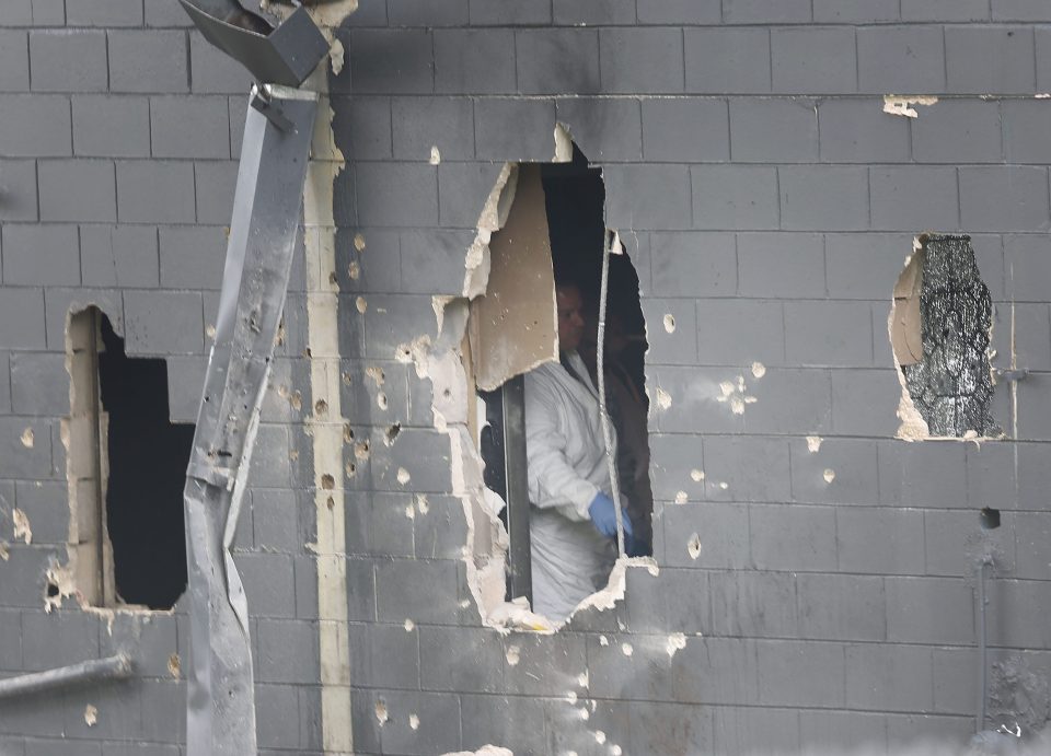  Officers blasted a whole through the club wall in a bid to distract the shooter