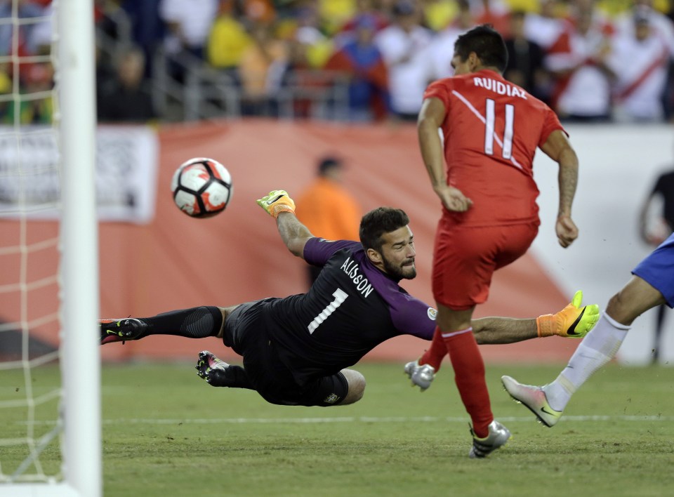 Peru's Raul Ruidiaz scores past Brazilian goalkeeper Allison as the five-time world champions got knocked out of the Copa America in the group stages