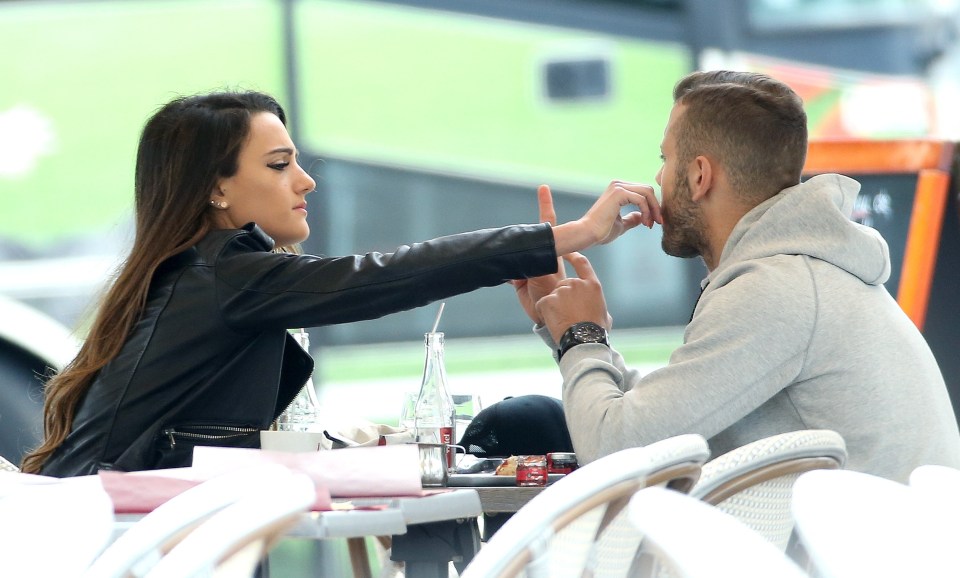  Andriani Michael cleans fiance Jack Wilshere's face as they spend time together in Chantilly