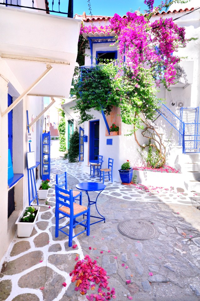  Traditional greek architecture in a narrow alley in Skiathos town