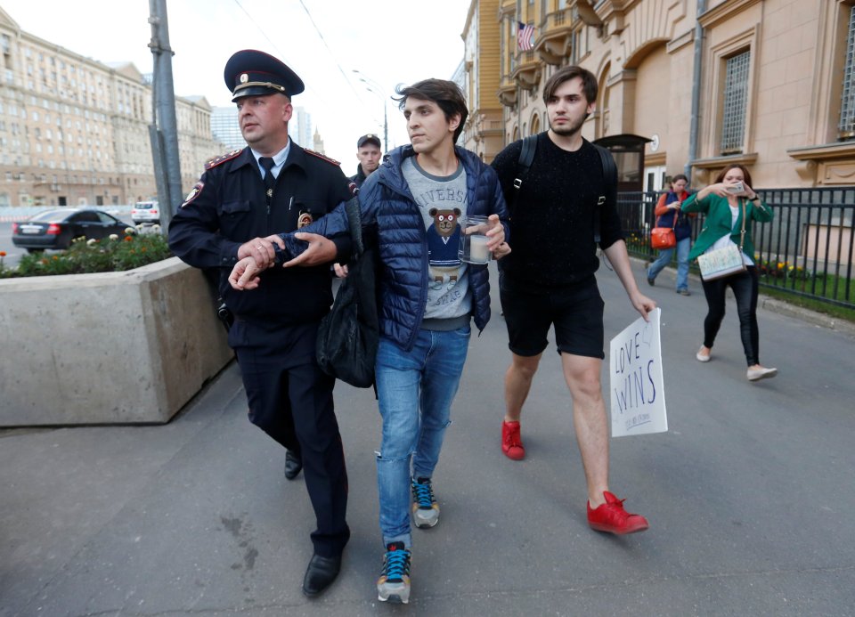  Arrest ... Russian man is scooped for trying to light a candle in tribute to Orlando dead