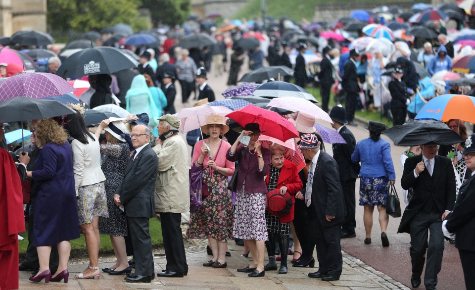 In defiance of the weather, hundreds of people gathered to get a glimpse of the royals