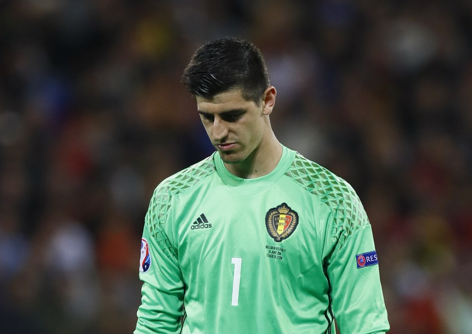 Downbeat Thibaut Courtois reacts after conceding the second goal against Italy