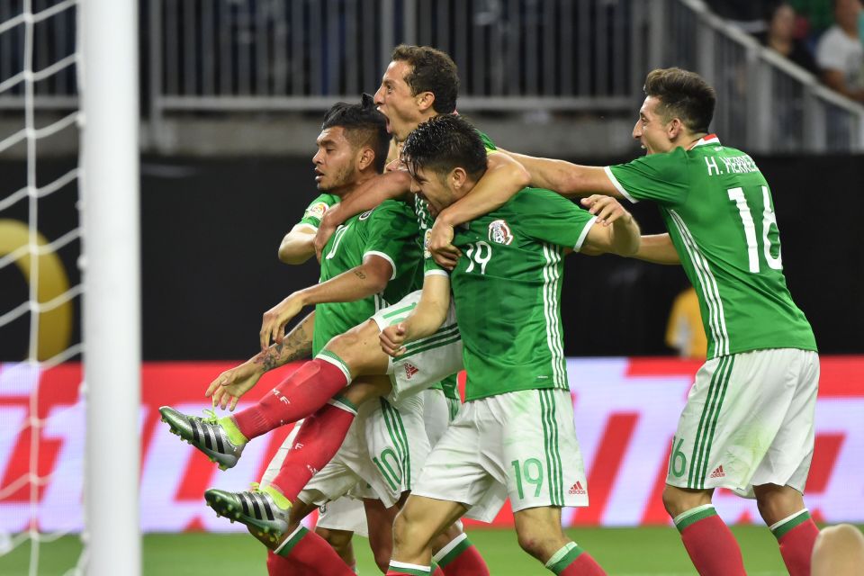 Mexico's Jesus Manuel Corona (L) celebrates with teammates after scoring against Venezuela during their Copa America Centenario football tournament match in Houston, Texas, United States, on June 13, 2016. / AFP PHOTO / Nelson ALMEIDANELSON ALMEIDA/AFP/Getty Images