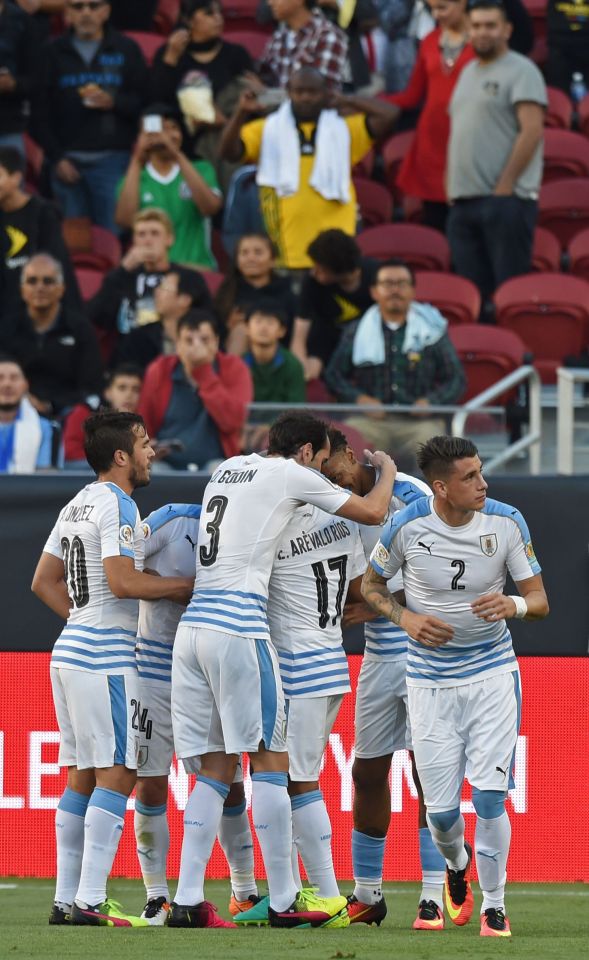 Uruguay's Abel Hernandez (2-L) celebrates with teammates after scoring against Jamaica during their Copa America Centenario football tournament match in Santa Clara, California, United States, on June 13, 2016. / AFP PHOTO / Mark RALSTONMARK RALSTON/AFP/Getty Images