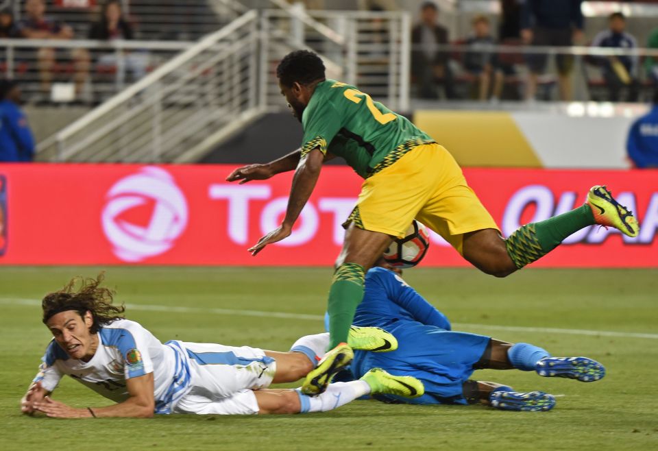 Uruguay's Edinson Cavani (L) falls in the Jamaican area during the Copa America Centenario football tournament match in Santa Clara, California, United States, on June 13, 2016. / AFP PHOTO / Mark RALSTONMARK RALSTON/AFP/Getty Images