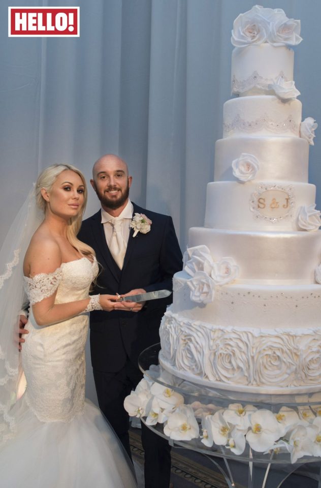  Stephen Ireland and new wife Jessica tackle their huge wedding cake which stood at 6ft tall