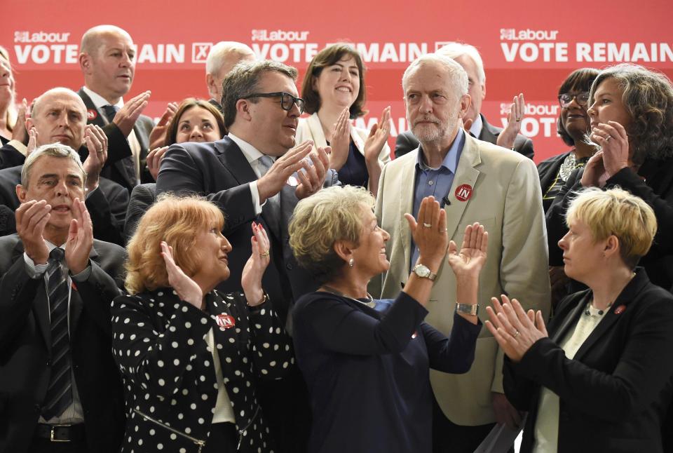 Britain's opposition Labour Party's leader Jeremy Corbyn is applauded by other senior members of the party and trade unionists as they pose for a group photo at an event in support of remaining in the European Union, in central London