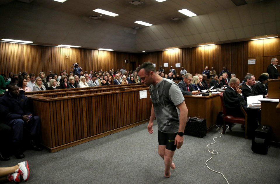  Murderer Oscar Pistorius walks across the courtroom just on his stumps