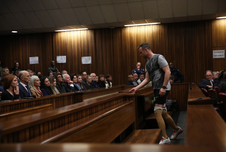  A humiliated Pistorius leaves his seat to be paraded across the courtroom floor