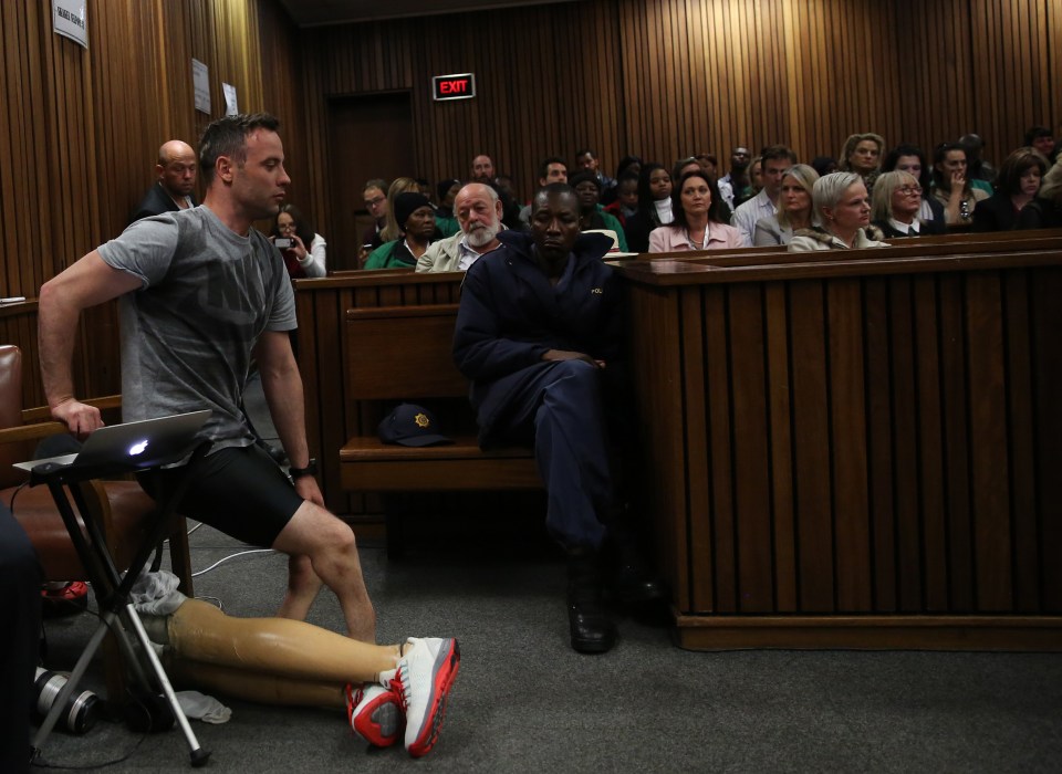  Barry Steenkamp looked on as Oscar Pistorius took off his prosthetic legs to walk on his stumps