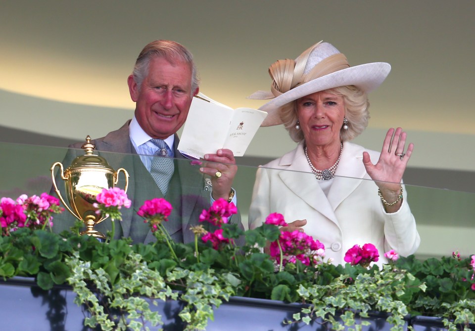  Prince Charles and his wife Camilla, who had also opted for a cream colour scheme for the second day of racing