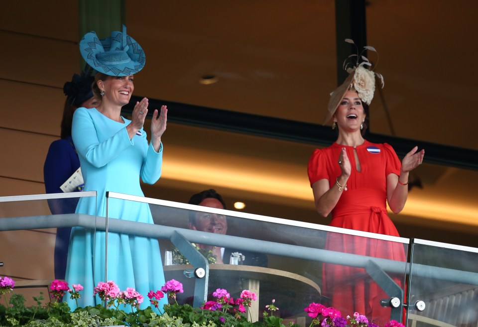  Sophia, Countess of Wessex and Princess Mary of Denmark both opted for bright coloured dresses and fascinators and clapped the racing