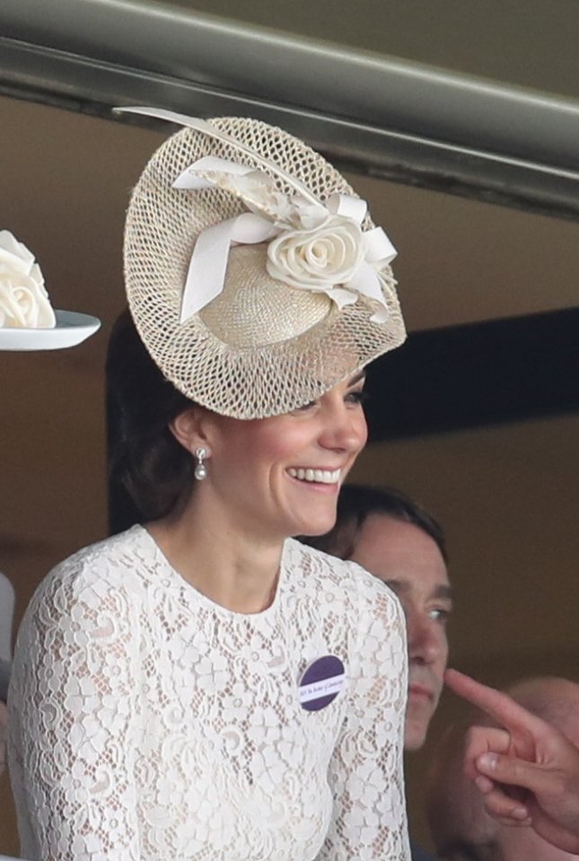  The Duchess looks on from the Royal box as her horse comes in and she could be on to a winner. She accompanied her husband the Duke of Cambridge, who will present a trophy later on in the day