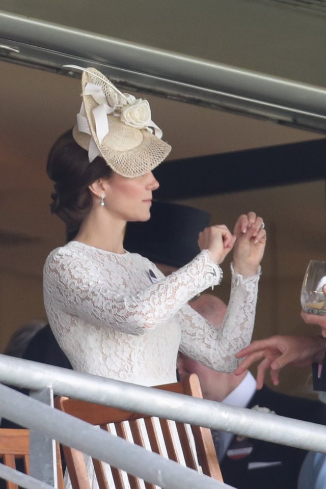  Either about to win or having just won Kate celebrates with a jig as she watches the horses finish a race on the second day of Royal Ascot