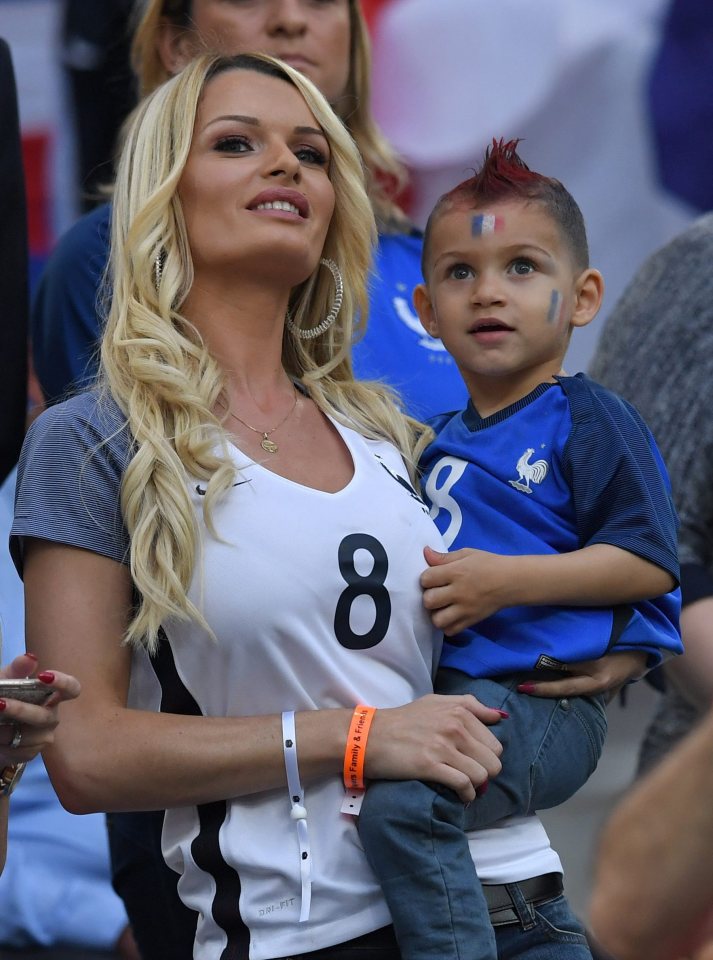  Dimitri Payet's wife Ludivine watches the French ace in action from Marseille's Stade Velodrome with their son. Les Bleus beat Albania 2-0 on Wednesday