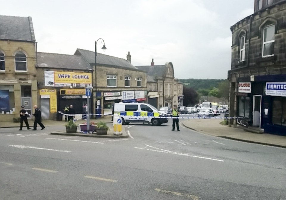  Crime scene ... The centre of the quiet Yorkshire village was being scoured for evidence yesterday