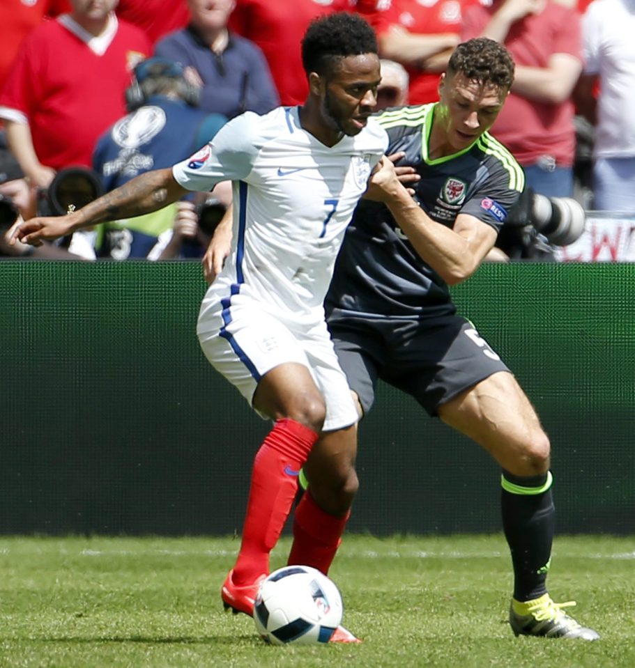 Raheem Sterling (L) of England in action against James Chester