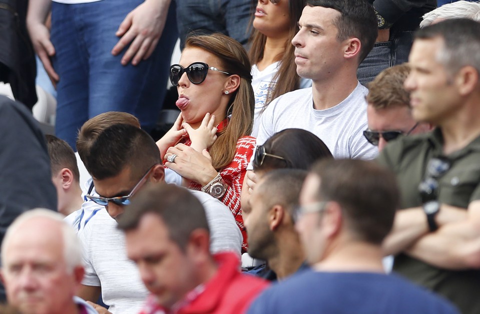  The England's captain's wife keeps her kids entertained during the match