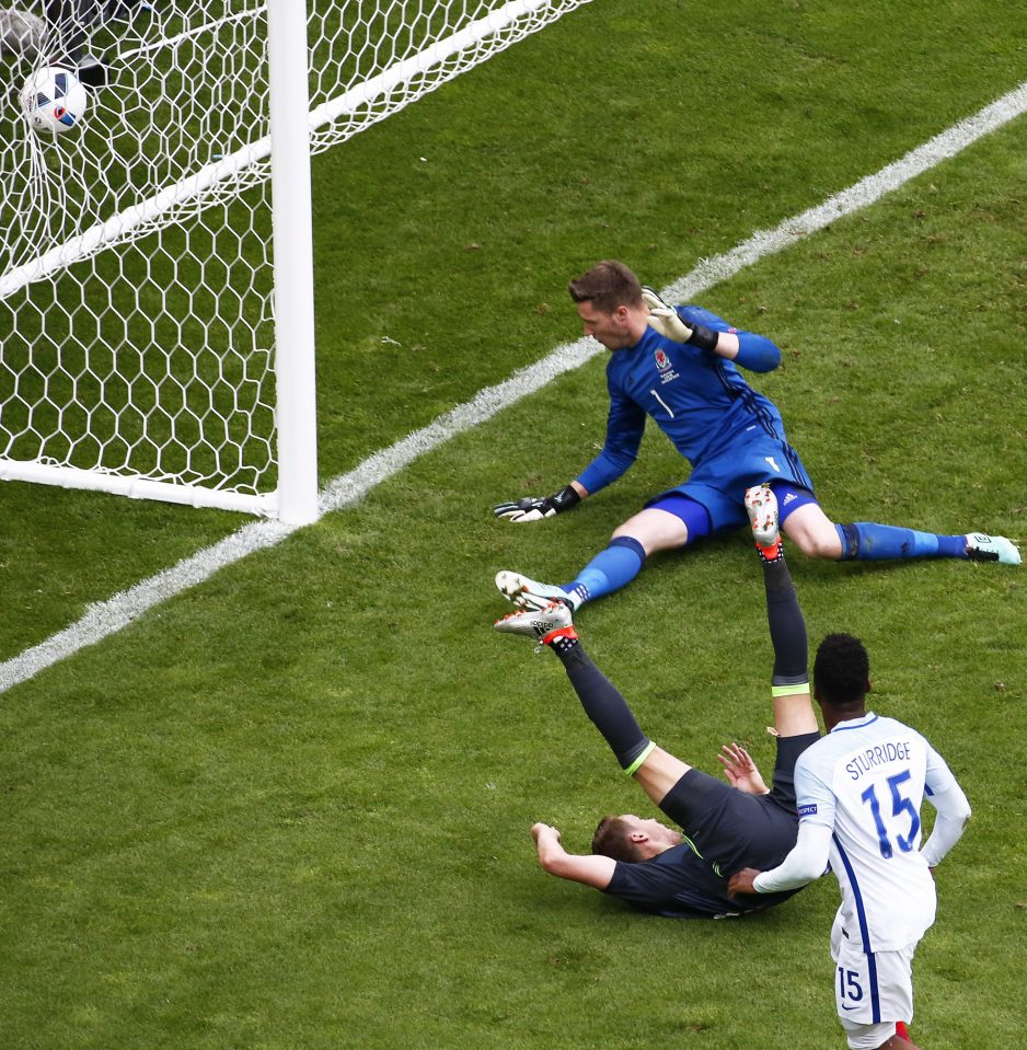 Daniel Sturridge (front) of England scores the winner against Wales