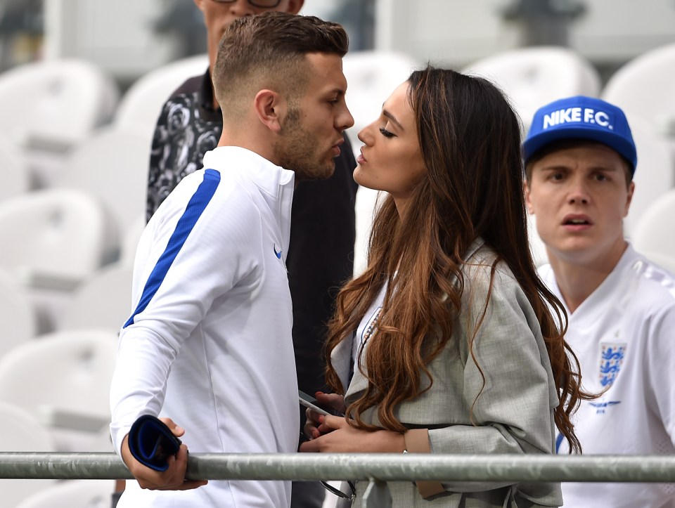  Midfielder Jack kisses his partner following England's victory