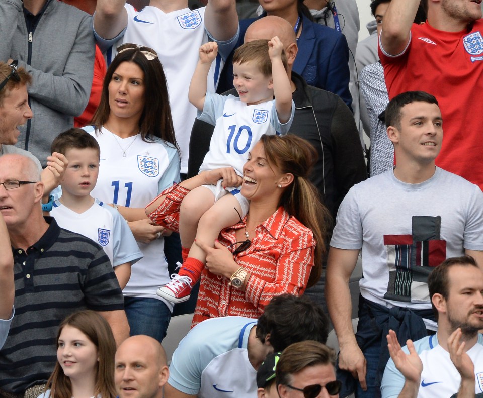  Coleen, pictured with her son Klay on her shoulder, celebrates the team's heroics alongside WAG-of-the-moment Becky