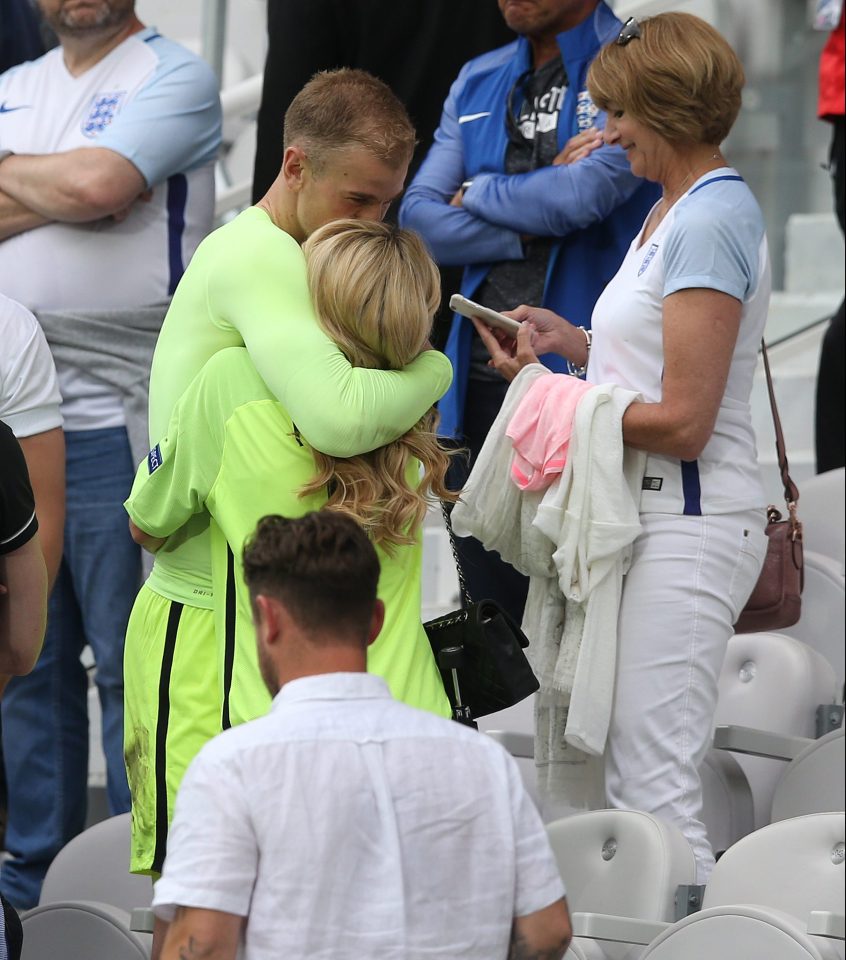  Joe Hart embraces his wife Kimberly after the game